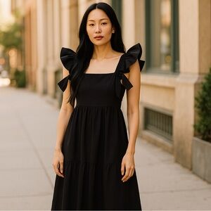 Mi Ami, open, tie back black dress, ruffle sleeves,  stretchy smocked bodice.